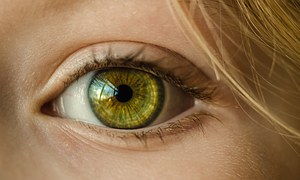 Green contact lenses, blond hair